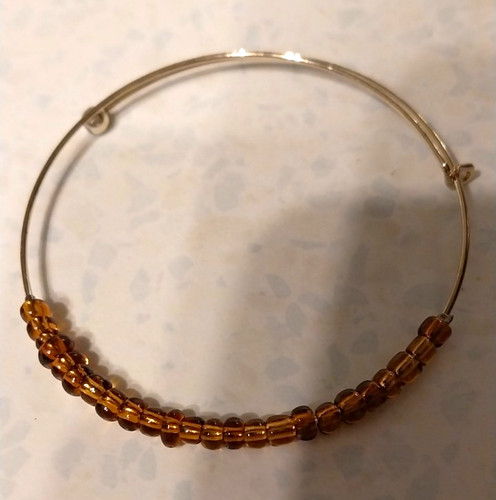 Gold tone adjustable wire - tone,